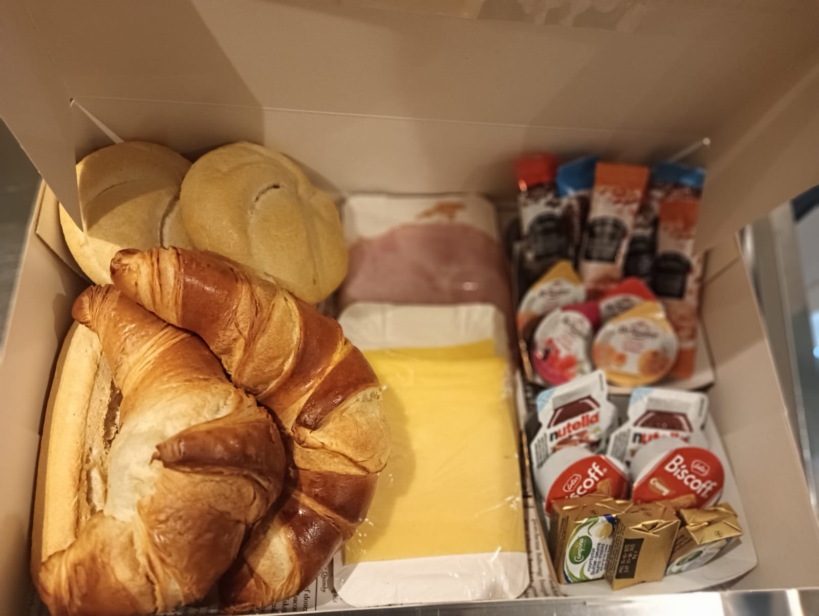 Assorted breakfast pastries and spreads